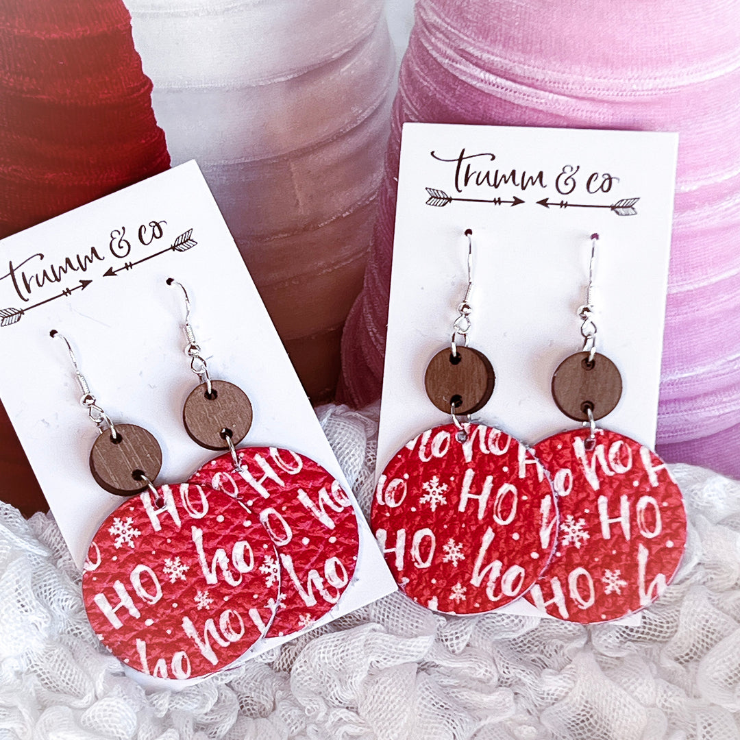 Red leather Ho ho saying earrings with a holiday theme