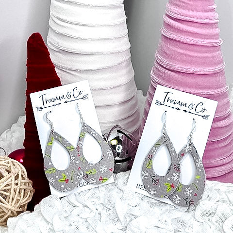 Open teardrop holiday earrings with berries and snowflakes