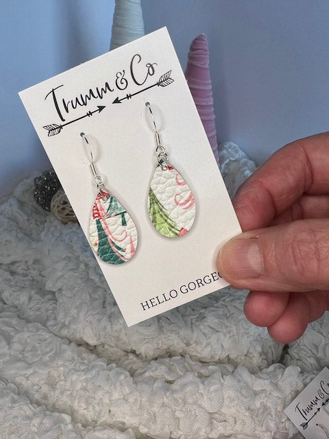 close up of small tear drop holiday tree earrings
